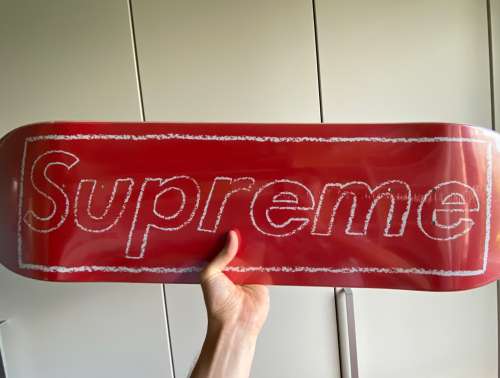 Supreme KAWS deck skateboard red